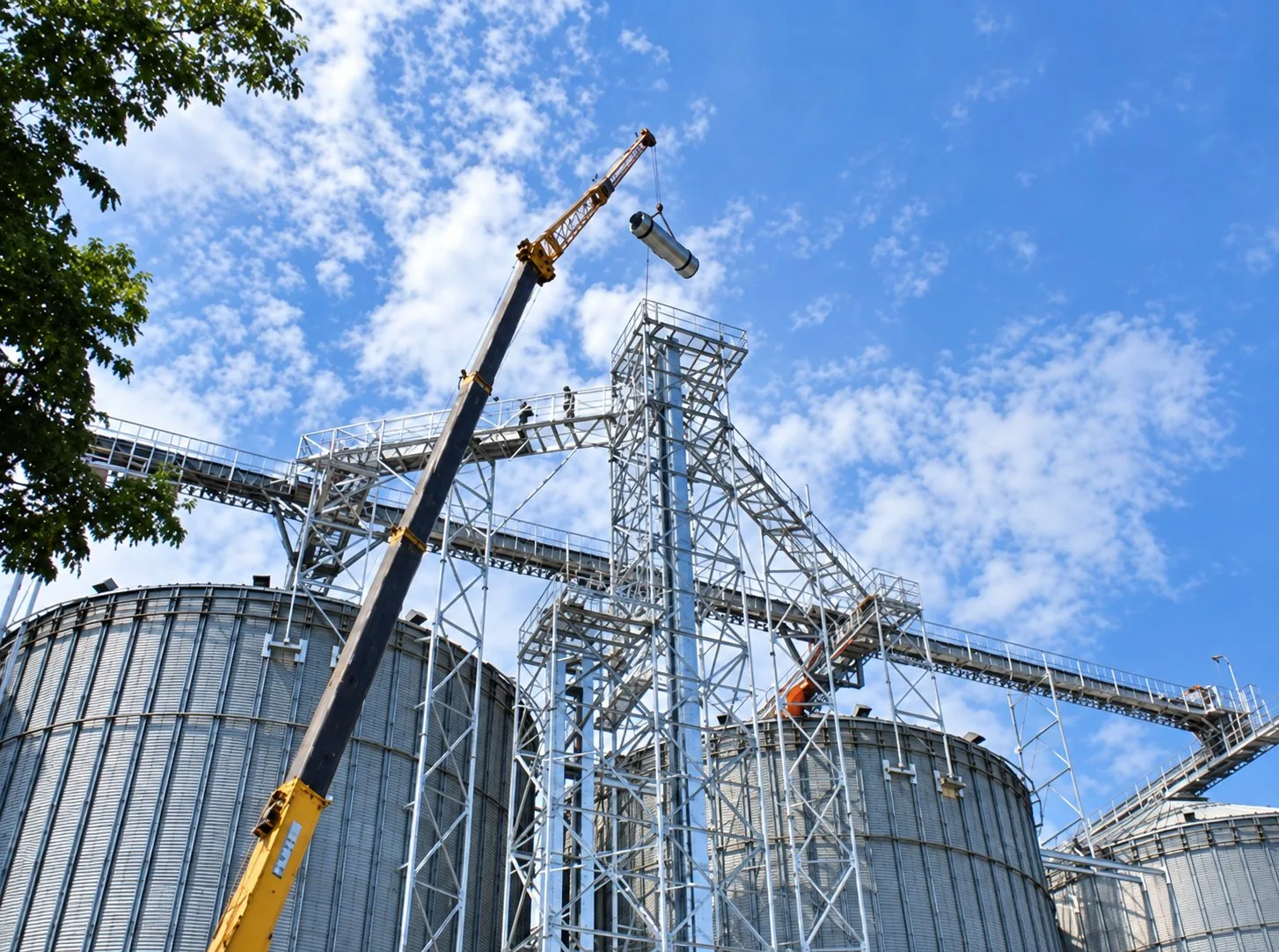 Crane lifting equipment onto a steel structure